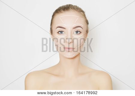 Closeup of female adult with marks on skin for cosmetic medical procedures