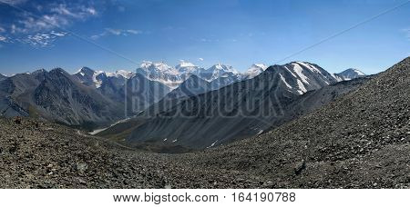 Panorama of the Altai Mountains with snowcaps. View from the highland pass Karaturek.
