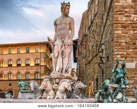 Statue of Neptune. Piazza della Signoria. Sunset, dramatic sky. Florence, Italy.