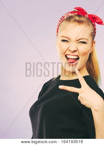 Craze fun and positive madness. Woman showing her funny face feel carefree. Girl in retro pin up fashion style present crazy behave.