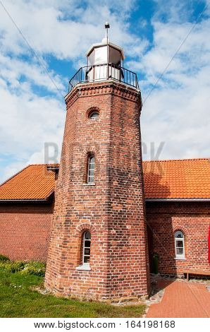 Old brick lighthouse Ventes Ragas in Lithuania