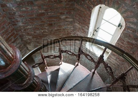 Old spiral forged iron staircase inside the lighthouse