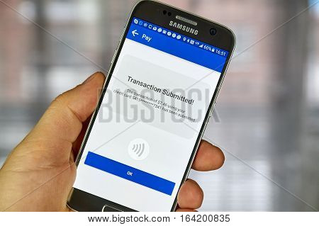 MONTREAL CANADA - DECEMBER 23 2016 : NFC payment android application on Samsung S7 screen.