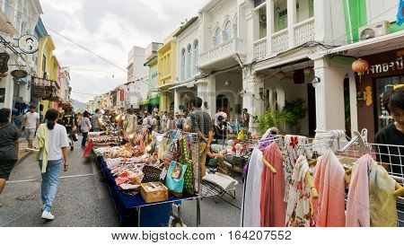PHUKET THAILAND NOVEMBER 27: Tourists enjoy shopping at the walking street among old building Chino Portuguese style on street of Phuket town Thailand on November 27 2016.