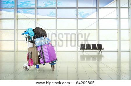 Airport luggage Trolley with suitcases in an airport