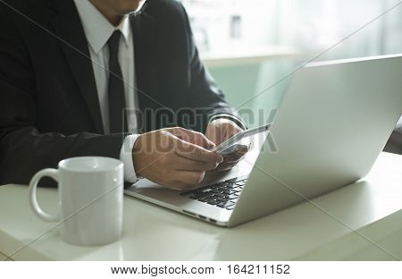 businessman hand using smart phonemobile payments online shopping.Seleted focus.