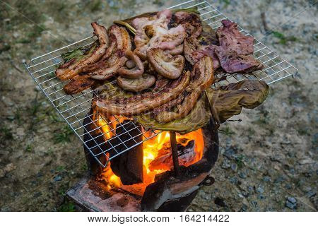 Grilled pork and entrails with banana leaf