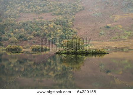 Beautiful Autumn Fall Landscape Image Of Crummock Water At Sunrise In Lake District England