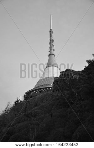 Black and white view on Czech monument Ještěd on rocks