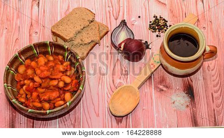 Romanian Traditional Food, Beans With Smoked Pork (fasole Cu Ciolan), Red Onion, Wooden Spoon, Bread