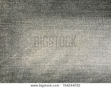 Texture of gray jeans demim fabric background