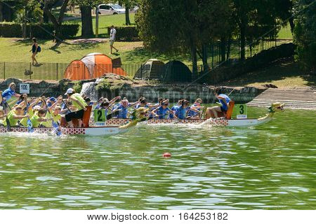 Rome Italy - July 30 2016: Dragon boat crews compete at the european championships held in Italy in 2016 summer in the photo the Italian crew against the Ukraine crew during the race