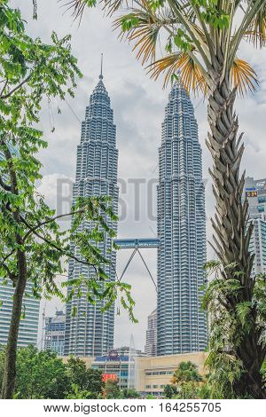 Kuala Lumpur, Malaysia - February 10, 2016: Majestic view of Petronas Twin Towers at sunset in Kulala Lumpur Malaysia.