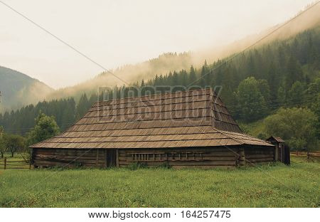 Old wooden hut in Ukrainian mountains Carpathians. The apartments Hutsul family that lived in the last century