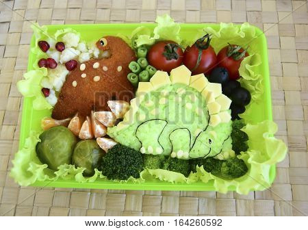 The dinosaur is made of rice. Creative food for good mood and appetite. Kyaraben, bento