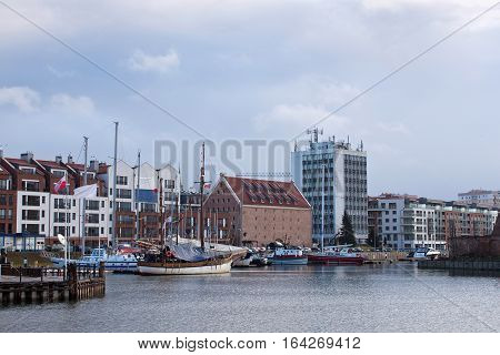 View of the marina in Gdansk on the Motlawa river with small ships in the city center. Poland.
