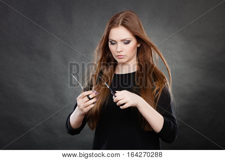 Elegance and classy. Fashion style of hairdo. Female professionalist with scissors. Elegant woman presents her hairdresser's saloon.