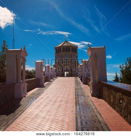 Famous orthodox monastery of Kykkos, Holy monastery of the Virgin of Kykkos in Cyprus. Way to the church near king Macarius grave. Travel sightseeing image