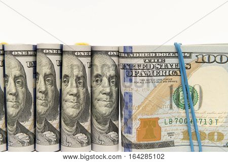 Packs of hundred dollar banknotes with rubber bands