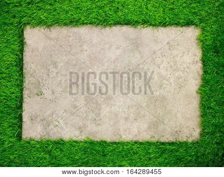 Square concrete plate on artificial green grass background