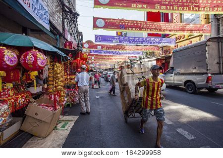 THAILAND BANGKOK - FEB 24 : side street shop in yaowarat bangkok china town preparing goods for chinese new year decoration on february 242015 in bangkok thailand