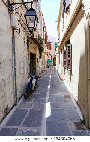 Rethymnon, Island Crete, Greece - July 1 2016: The narrow street with street lamp in Rethymnon (part of Old Town)