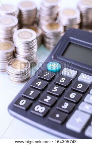Couns And Calculator On White Background
