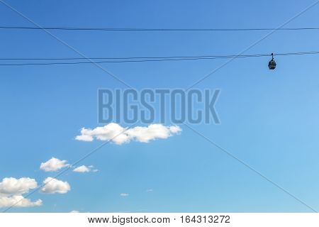 Movement of the cabin of cableway blue sky and white clouds
