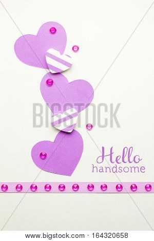 Creative valentines concept photo of hearts made of paper on white background.