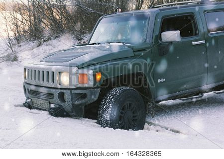 The river Tosno, Leningrad oblast, Russia - January 01, 2017, H3 Hammer on the shore of the river, the Hummer H3 is a compact SUV produced by GM