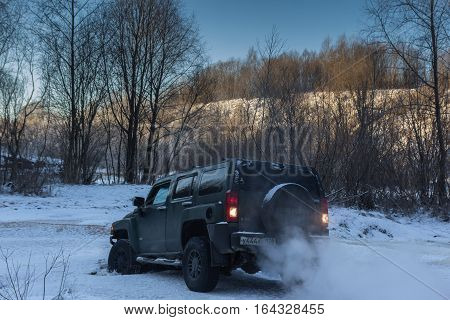 The river Tosno, Leningrad oblast, Russia - January 01, 2017, H3 Hammer on the shore of the river, the Hummer H3 is a compact SUV produced by GM