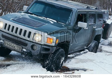The river Tosno, Leningrad oblast, Russia - January 01, 2017, H3 Hammer on the shore of the river, the Hummer H3 is a compact SUV produced by GM
