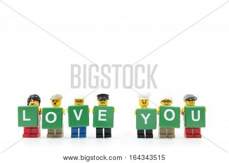 Chiang Mai Thailand - January 8 2017 : Studio shot of LEGO minifigure holding word LOVE YOU on white background
