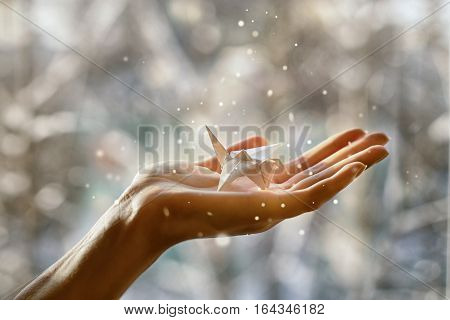 Fabulous paper crane in the palm of your hand