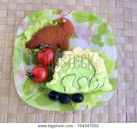 The dinosaur is made of rice. Kyaraben, bento. Creative food for children