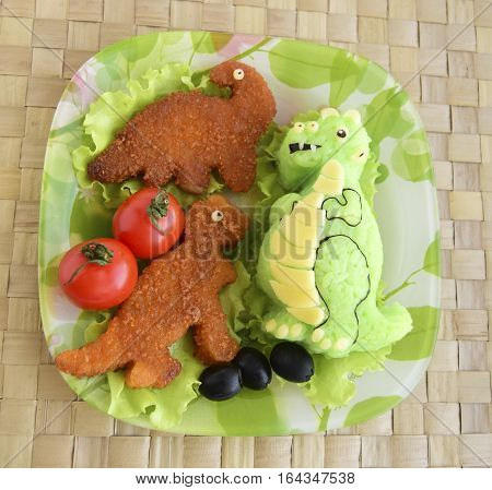 The dinosaur is made of rice. Kyaraben, bento. Creative food for children.