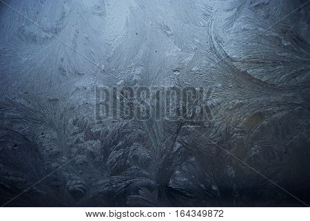 Blue frosting window with ice on it