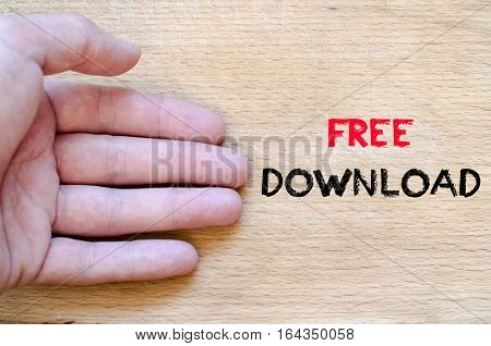 Human hand over wooden background and free download text concept