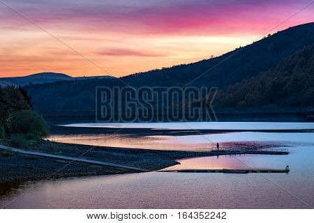 Fishing at Ladybower Reservoir in the Peak District National Park in the evening.