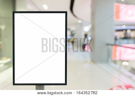Blank mock up of vertical poster billboard sign with copy space for your text message or content in modern shopping mall.
