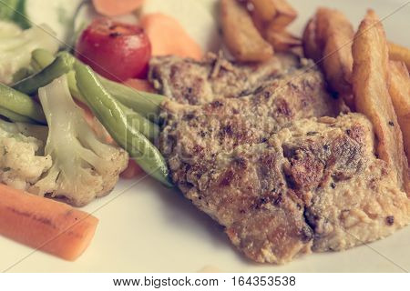 Grilled chicken steak with potatoes and vegetables. Healthy and nutritious diet.