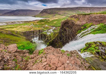 Mountain River Flowing Into The Lake Between The Mountains, Iceland