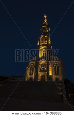 Church of Saint Michael in Saint-Michel-Mont-Mercure France with a large figure of the Archangel Michael at the top of the tower
