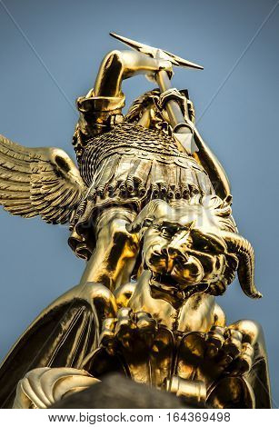 Archangel Michael fighting the dragon from the tower of the church in the town of Saint-Michel-Mont-Mercure France