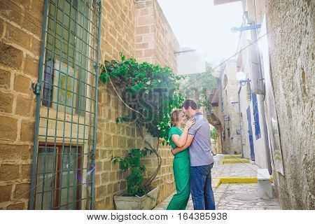 Beautiful Happy Couple Embracing And Walking On The Streets Of The Ancient City