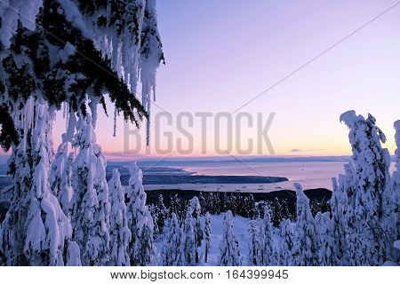 Winter sunset over the ocean. Grouse Mountain Park. North Vancouver. British Columbia. Canada.