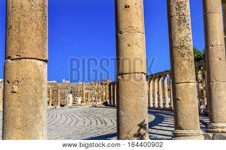 Oval Plaza 160 Ionic Columns Ancient Roman City Jerash Jordan. Jerash came to power 300 BC to 100 AD and was a city through 600 AD. Not conquered until 1112 AD by Crusaders. Famous Trading Center. Most original Roman City in the Middle East.