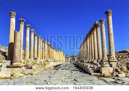 Corinthian Columns Ancient Roman Road City Jerash Jordan. Jerash came to power 300 BC to 100 AD and was a city through 600 AD. Not conquered until 1112 AD by Crusaders. Famous Trading Center. Most original Roman City in the Middle East.
