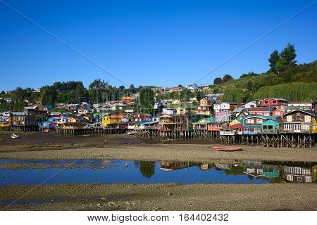 Colorful Palafitos traditional wooden stilt houses at low tide in Castro the capital of the Chiloe Archipelago in Chile