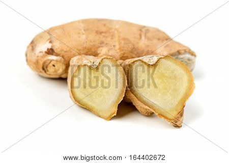 Sliced Ginger Root With A Heart Shape Isolated On A White Background